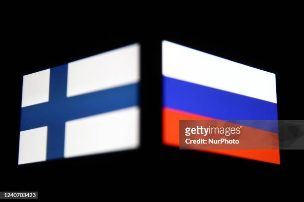 Flags of Finland and Russia displayed on phone screens are seen in this multiple exposure illustration photo taken in Krakow, Poland on May 15, 2022.