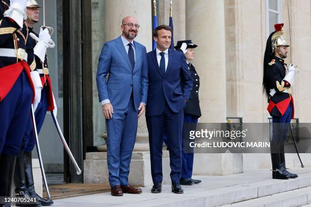 France's President Emmanuel Macron poses with European Council President Charles Michel prior to a working lunch at the presidential Elysee Palace in...