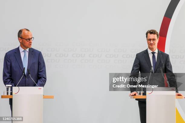 Friedrich Merz , leader of the German Christian Democrats , and Hendrik Wüst, CDU premier of North Rhine-Westphalia, attend a joint press conference...