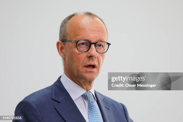 Friedrich Merz , leader of the German Christian Democrats , and Hendrik Wüst, CDU premier of North Rhine-Westphalia, attend a joint press conference...