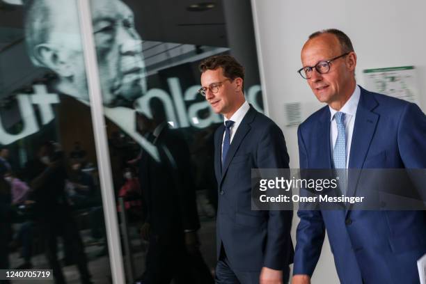Friedrich Merz , leader of the German Christian Democrats , and Hendrik Wüst, CDU premier of North Rhine-Westphalia, attend a joint press conference...