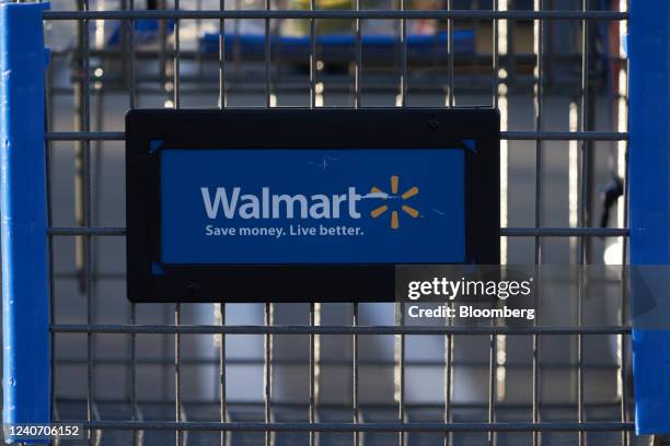 Shopping cart outside a Walmart store in Torrance, California, US, on Sunday, May 15, 2022. Walmart Inc. Is scheduled to release earnings figures on...