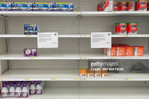 Sign stand next to a small amount of toddler nutritional drink mix at Target in Stevensville, Maryland, on May 16 as a nationwide shortage of baby...