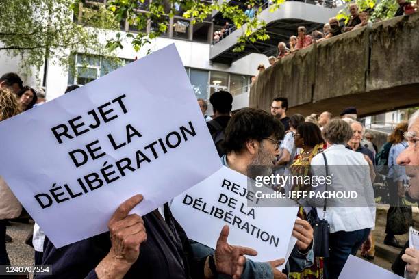People gather outside the Grenoble Metropole building to protest against an ongoing city council session set to scrap its bathing dress code in...
