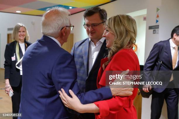 Ukraine's Foreign Minister Dmytro Kuleba and Canadian Foreign Minister Melanie Joly are welcomed by High Representative of the EU for Foreign Affairs...