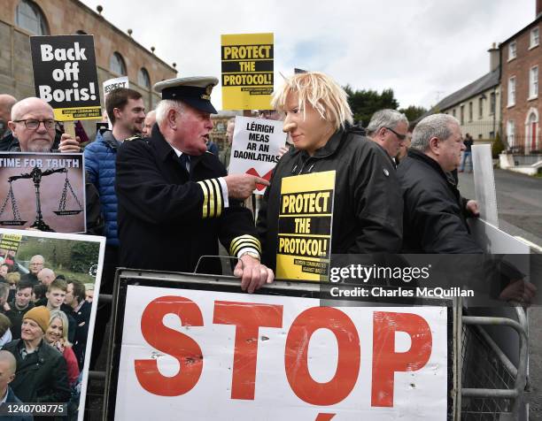 Man wearing a Boris Johnson mask stands with a fellow 'Border Communities against Brexit' campaigner dressed as a customs guard as they stage a...