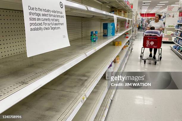 Woman shops for baby formula at Target in Annapolis, Maryland, on May 16 as a nationwide shortage of baby formula continues due to supply chain...