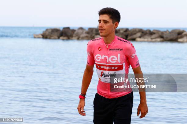 Team Trek's Spanish rider Juan Pedro Lopez wearing the overall leader's pink jersey walks on the beach during the second rest day of the Giro...