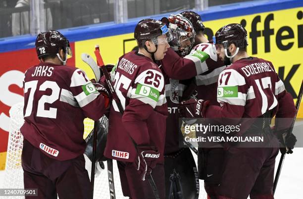 Latvia's players celebrates after winning the IIHF Ice Hockey World Championships 1st Round group B match between Latvia and Norway at the Nokia...