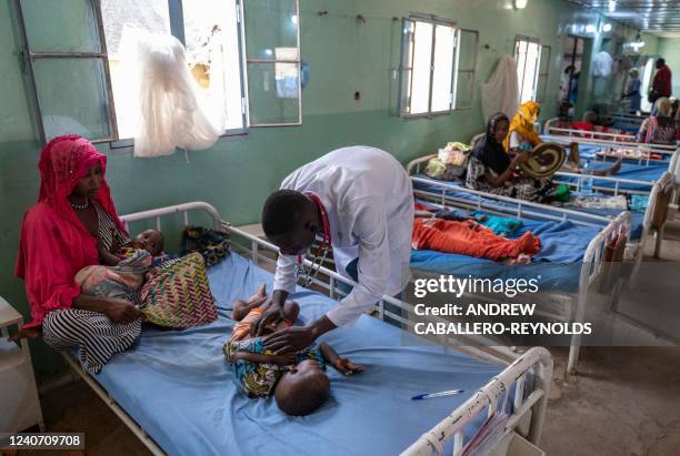 Doctor examines malnourished children in the first stage recovery section for patients in the ALIMA managed nutrition unit of the hospital Tchad/...