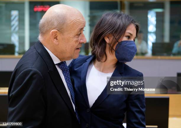 French Minister of Europe and Foreign Affairs Jean-Yves Le Drian is greeting the German Minister of Foreign Affairs Annalena Baerbock prior the start...