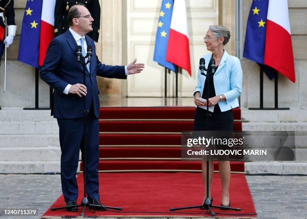 France's outgoing Prime Minister Jean Castex delivers a speech next to his successor, former Labour Minister Elisabeth Borne , during a handover...