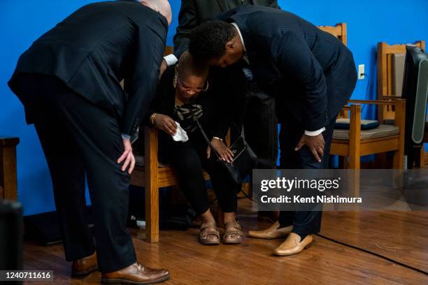 Tiffany Whitfield, granddaughter of the late Ruth Whitfield is comforted during a news conference with Attorney Ben Crump and members of the family...