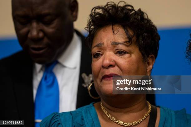 Angela Crawley, daughter of the late Ruth Whitfield, tears up during a news conference with Attorney Ben Crump and members of the family of the late...