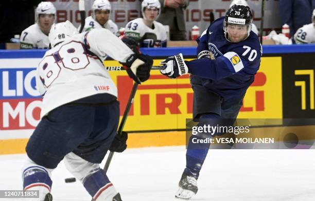Finland's forward Teemu Hartikainen and USA's defender Nate Schmidt vie for the puck during the IIHF Ice Hockey World Championships 1st Round group B...