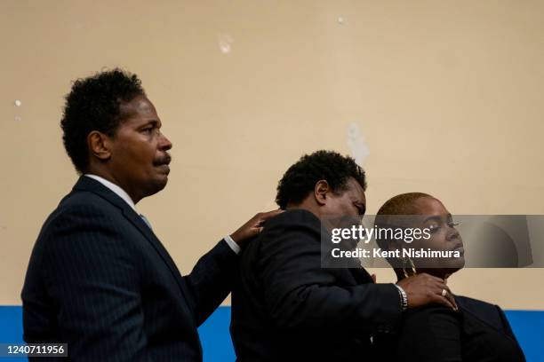Rayond Whitfield, Granell Whitfield Jr., and Tiffany Whiftfield are seen during a news conference with Attorney Ben Crump and members of the family...