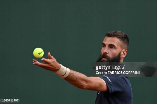France's Benoit Paire serves a ball to Finland's Emil Ruusuvuori during their match at the ATP 250 Geneva Open tennis tournament in Geneva on May 16,...
