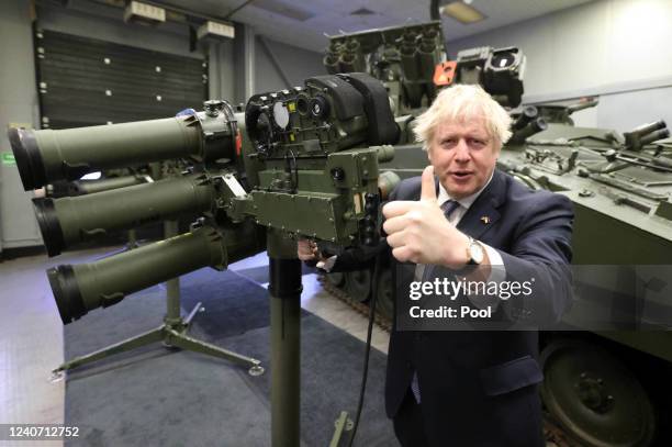 Prime Minister Boris Johnson with a Mark 3 shoulder launch LML missile system at Thales weapons manufacturer during a visit to Northern Ireland for...