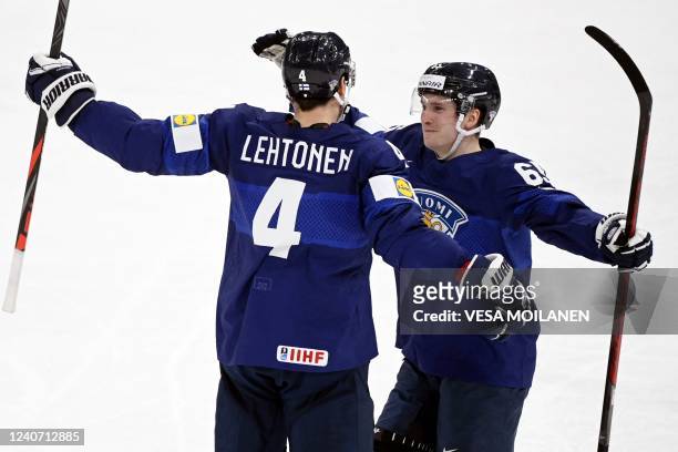 Finland's defender Mikko Lehtonen celebrates scoring with Finland's forward Sakari Manninen during the IIHF Ice Hockey World Championships 1st Round...