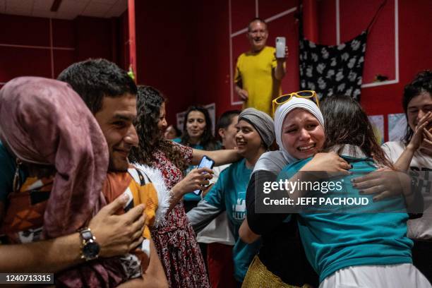 Members of the pro-burkini association « Alliance Citoyenne » celebrate after members of the municipal council voted to allow the wearing of the...