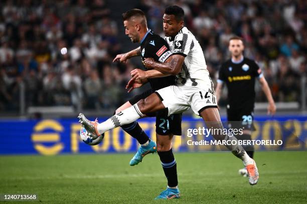 Lazios midfielder Sergej Milinkovic-Savic from Serbia vies for the ball with Juventus defender Alex Sandro from Brazil during the Serie A football...