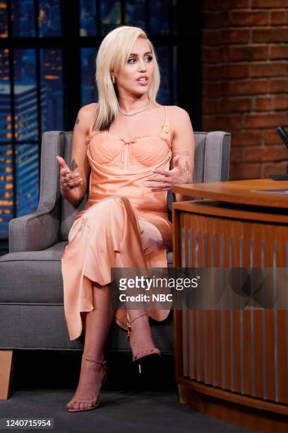 Episode 1292 -- Pictured: Singer Miley Cyrus during an interview with host Seth Meyers on May 16, 2022 --