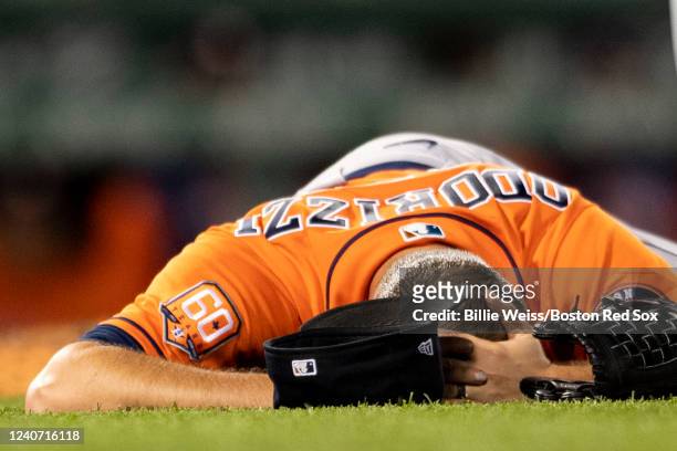 Jake Odorizzi of the Houston Astros reacts after an injury during the fifth inning of a game against the Boston Red Sox on May 16, 2022 at Fenway...