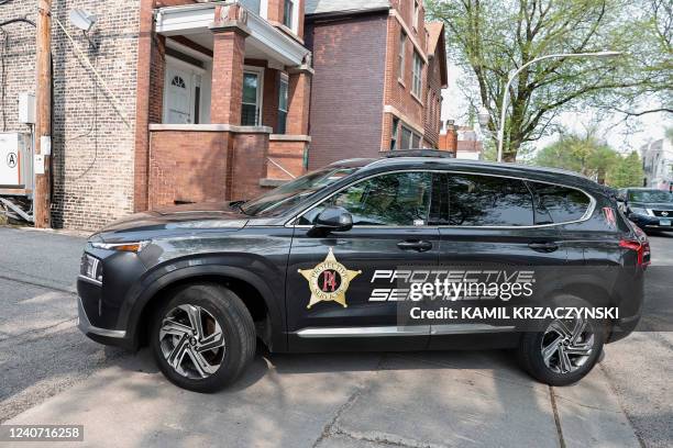 Colton Jeralds, an off-duty police officer, monitors the streets as he works for P4 Security Solutions in the Wicker Park neighborhood of Chicago,...