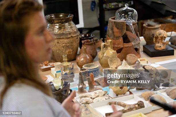 Leah Stricker, curator, discusses artifacts in the vault at Jamestown, Virginia, on May 10, 2022. - Water arrived overnight and submerged an ancient...