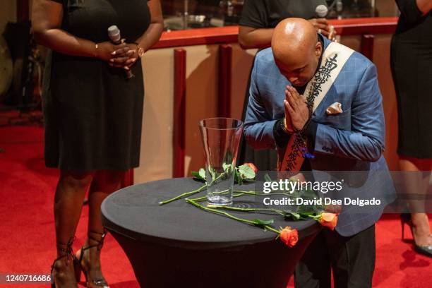 Interfaith ministers lay down roses on the pulpit of Bethel Gospel Assembly - Destiny Worship Pavilion on May 16, 2022 in New York City. The vigil...