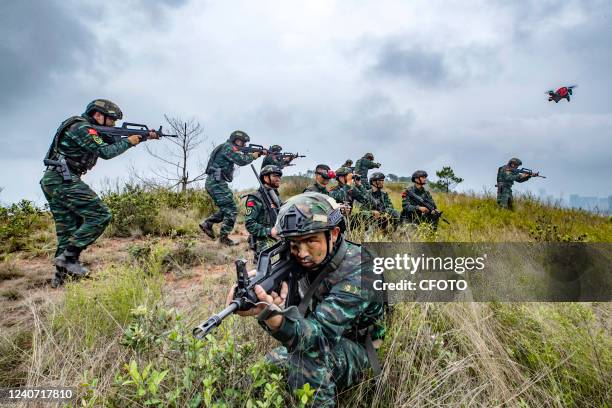 Members of special operations forces take part in an anti-terrorism drill in Yulin, South China's Guangxi Zhuang Autonomous Region, May 17, 2022.