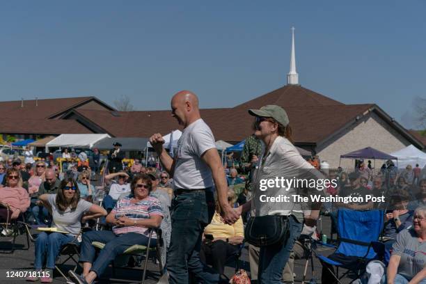 State Senator and gubernatorial candidate Doug Mastriano and his wife Rebbeca walk toward the podium to give a speech at a Shield of Truth Network...