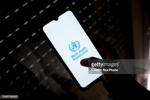 In this photo illustration a World Health Organization logo seen displayed on a smartphone screen in Athens, Greece on May 16, 2022.