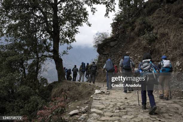Trekkers making their way to everest base camp near in Lukla, Nepal on April 21, 2022. Rising food and energy prices have lowered Nepal's annual...