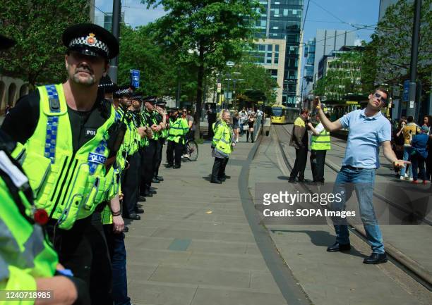Charles Veitch dances to the Pro-Trans Music while the police stand in a line during the demonstration. Charles Veitch co-founded a group called The...
