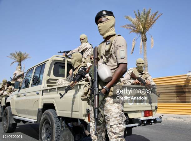 Vehicles of forces loyal to Libya's Tripoli-based Prime Minister Abdulhamid Dbeibeh are parked after forces of the rival Tobruk-based government...