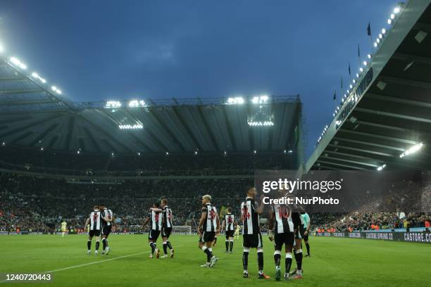 Newcastle United players celebrate their sides first goal during the Premier League match between Newcastle United and Arsenal at St. James's Park,...