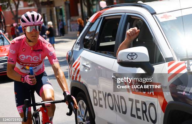 Team Trek's Spanish rider Juan Pedro Lopez wearing the overall leader's pink jersey seeks sun cream from the medical car during the 10th stage of the...