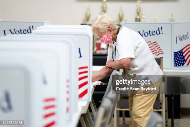 Woman votes at a polling booth on May 17, 2022 in Norwood, North Carolina, United States. North Carolina is one of several states holding midterm...