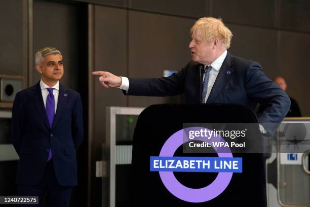 Britain's Prime Minister Boris Johnson gives a speech as Mayor of London Sadiq Khan watches, to mark the completion of London's Crossrail project at...