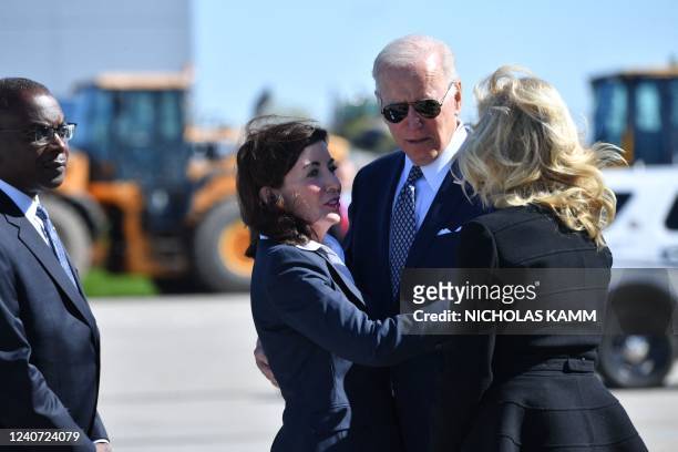 President Joe Biden embraces New York State Governor Kathy Hochul after disembarking Air Force One at Buffalo Niagara International Airport in...