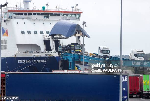 Lorries are driven off of the P&O ferry 'European Causeway' after arriving at Larne port, north of Belfast in Northern Ireland on May 17, 2022. The...