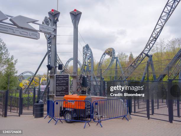 Crowd control barriers surround a mobile lighting generator at Alton Towers theme park, operated by Merlin Entertainments Ltd., in Alton, UK, on...