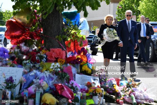 President Joe Biden and US First Lady Jill Biden arrive to a memorial near a Tops grocery store in Buffalo, New York, on May 17, 2022. - Biden is...