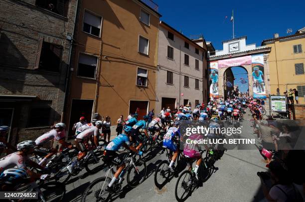 The pack of riders cycles through the town of Filottrano during the 10th stage of the Giro d'Italia 2022 cycling race, 196 kilometers between Pescara...