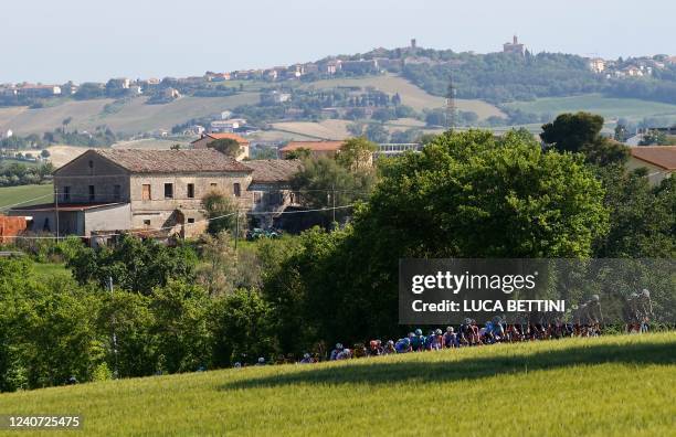 The pack of riders cycles during the 10th stage of the Giro d'Italia 2022 cycling race, 196 kilometers between Pescara and Jesi, central Italy, on...