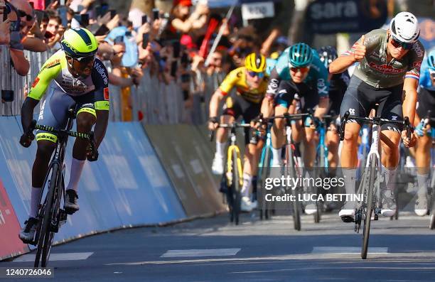 Team Alpecin-Fenix Dutch rider Mathieu van der Poel gives the thumbs up to Team Wanty's Eritrean rider Biniam Girmay Hailu who crosses the finish...