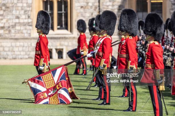 The new regimental colours of the 1st battalion Irish guards is paraded in the Quadrangle of Windsor Castle where they were presented to the regiment...