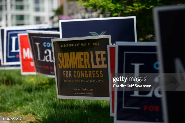 Campaign signs are seen on primary election day at the polls at the James Laughlin Hall on the campus of Chatham College on May 17, 2022 in...