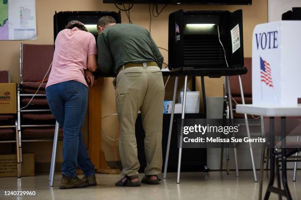 Couple fill out their ballots during Primary day on May 17, 2022 in Belews Creek, North Carolina. Residents are voting for who they want to replace...